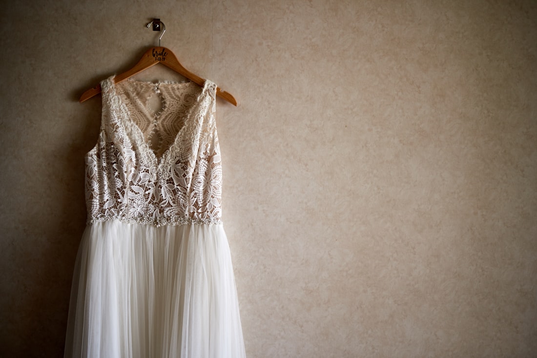 An A-line designer sample wedding dress on the rail at Bo & Co