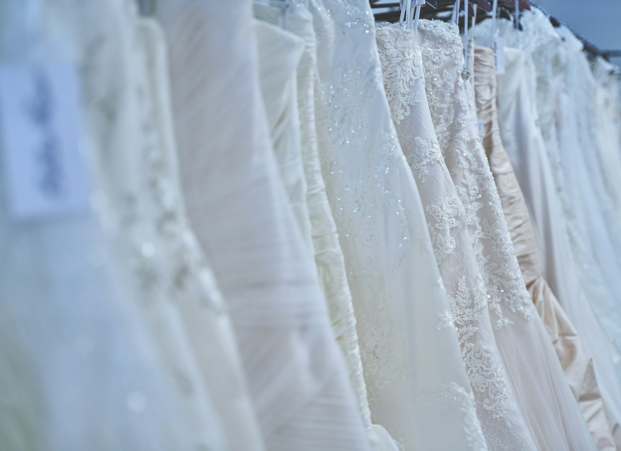 Designer sample wedding dresses on the rail at Bo & Co boutique in Wanstead, East London
